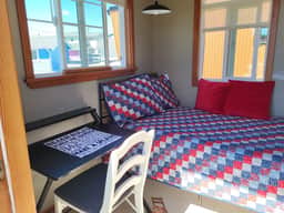 Sweet Caravan Tiny Home by creek & bay. Twin bed.